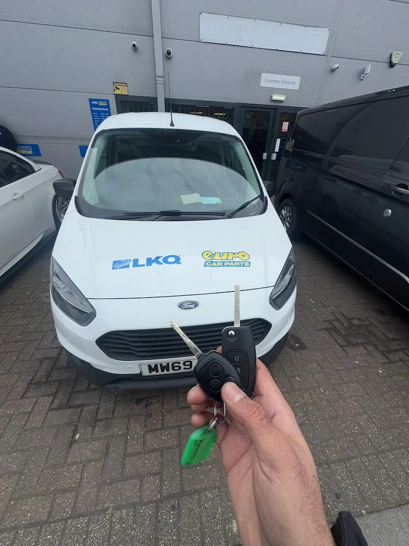 CNC key cutting machine producing a Ford key blade as part of an on-site key programming job in East London