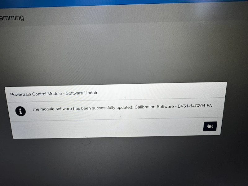 FDRS confirmation screen showing a Ford Powertrain Control Module software update completed successfully, calibration reference displayed